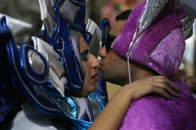 Two dancers kiss as they participate in a carnival parade in Valletta, Malta, February 7, 2016. (Photo by Darrin Zammit Lupi/Reuters)