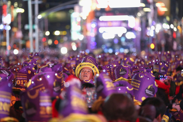 A reveler in Times Square in preparation for the New Year's celebration in Manhattan, New York City, U.S., December 31, 2016. (Photo by Stephen Yang/Reuters)