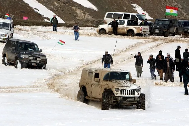 Kurdish visitors arrive to attend the Kurdistan Ice and snow festival held at Kudu Mountain near the Iraq-Iran border town of Haj Omran, in the autonomous Kurdistan region of Iraq, February 20, 2016. (Photo by Azad Lashkari/Reuters)