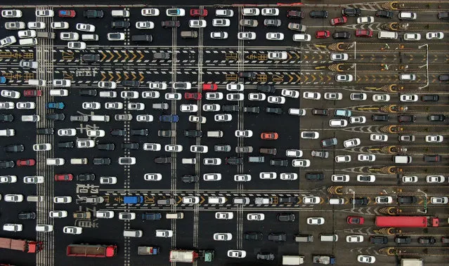 Aerial view of vehicles queuing at a toll station during 2019 Chinese Spring Festival travel rush on January 30, 2019 in Nanjing, Jiangsu Province of China. The 40-day Chinese Spring Festival travel rush starts from January 21 and lasts until March 1. The Spring Festival, or Chinese Lunar New Year, falls on February 5 this year. (Photo by Yang Bo/China News Service/VCG via Getty Images)