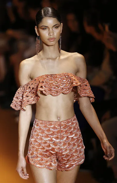 A model wears a creation from Agua de Coco Summer collection during the Sao Paulo Fashion Week in Sao Paulo, Brazil, Tuesday, April 14, 2015. (Photo by Andre Penner/AP Photo)