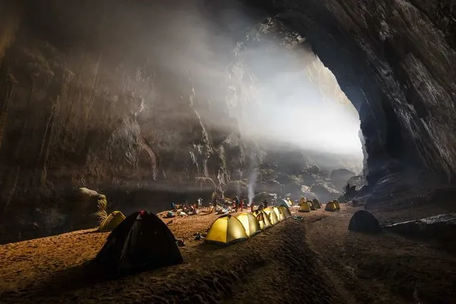 On September 17, National Geographic editors chose their Daily Dozen from among the thousands of photographs submitted to the online Your Shot community the day before. Included in those 12 images was this picture of tents set up for a night of camping inside Hang Son Doong – an underground passage – in Vietnam. (Photo by Ryan Deboodt/National Geographic)