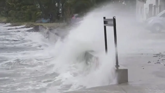 In this image made from video provided by AubC, waves hit a coastline in Bowen, Australia, Thursday, January 25, 2024. Strong winds hit Australia’s northeast coast Friday, leaving thousands without power, but the area was spared heavy damage as Tropical Cyclone Kirrily weakened into a tropical storm. (Photo by AuBC via AP Photo)