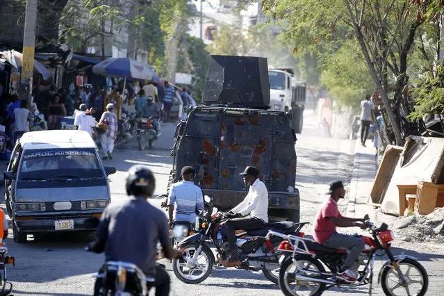 An armored police car patrols the streets in Port-au-Prince, Haiti, Friday, January 26, 2024. A court in Kenya on Friday blocked the deployment of a U.N.-backed police force to help fight gangs in the troubled Caribbean country. (Photo by Odelyn Joseph/AP Photo)