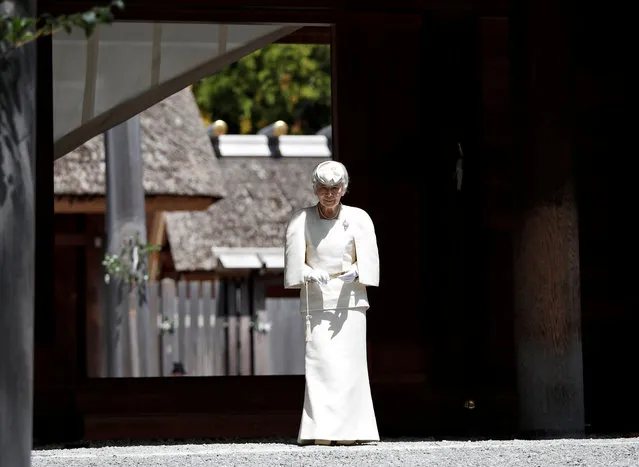 Japan's Empress Michiko walks from the main sanctuary as she visits at Outer shrine of the Ise Jingu shrine, ahead of Emperor Akihito's April 30, 2019 abdication, in Ise, central Japan, April 18, 2019. (Photo by Issei Kato/Reuters)