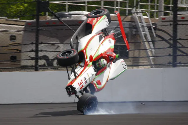 The car driven by Patricio O'Ward, of Mexico, goes airborne after hitting the wall in the second turn during practice for the Indianapolis 500 IndyCar auto race at Indianapolis Motor Speedway, Thursday, May 16, 2019 in Indianapolis. (Photo by Mike Fair/AP Photo)