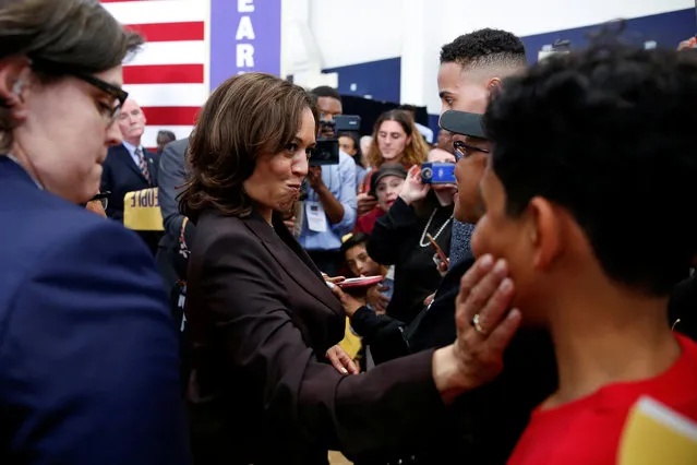 U.S. Senator Kamala Harris squeezes the cheeks of a young man after she had him shake her hand instead of making a high-five while greeting supporters following her first organizing event in Los Angeles as she campaigns in the 2020 Democratic presidential nomination race in Los Angeles, California, U.S., May 19, 2019. (Photo by Mike Blake/Reuters)
