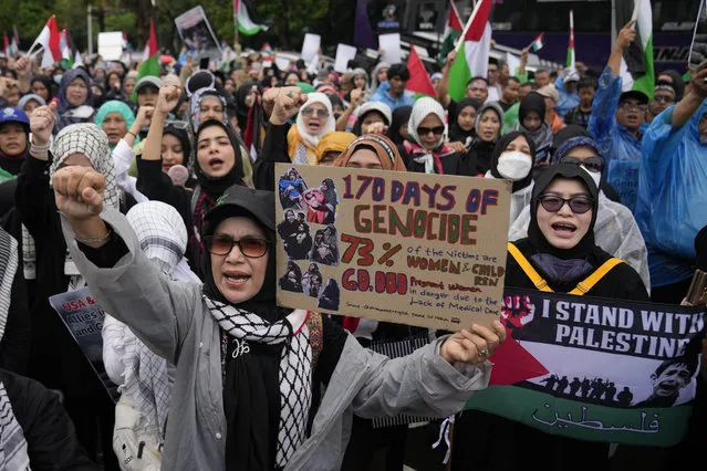 Muslim protesters shout slogans during an Al-Quds (Jerusalem) Day rally outside the U.S. Embassy in Jakarta, Indonesia, Friday, April 5, 2024. Al-Quds Day which was declared by the late Iranian spiritual leader Ayatollah Ruhollah Khomeini in 1979 as a day of struggle against Israel and to demonstrate the importance of Jerusalem to Muslims is observed every last Friday of the Muslim holy month of Ramadan. (Photo by Dita Alangkara/AP Photo)