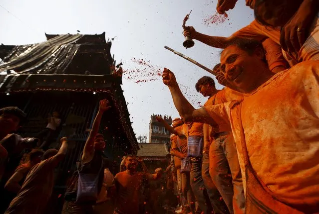 Devotees celebrate the “Sindoor Jatra” vermillion powder festival at Thimi, in Bhaktapur, Nepal, April 14, 2016. (Photo by Navesh Chitrakar/Reuters)