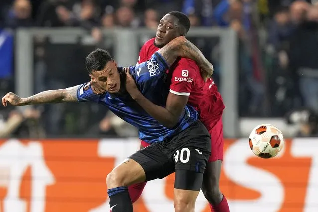 Liverpool's Ibrahima Konate fights for the ball with Atalanta's Gianluca Scamacca, left, during the Europa League quarterfinal, second leg, soccer match between Atalanta and Liverpool at the Stadio di Bergamo, in Bergamo, Italy, Thursday, April 18, 2024. (Photo by Antonio Calanni/AP Photo)
