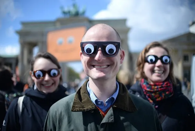 Employees with the German Protestant Kirchentag present the campaign “You see me” for the 36th German Protestant Kirchentag in Berlin and Wittenberg 2017 in front of the Brandenburg Gate in Berlin, Germany, 25 April 2016. (Photo by Britta Pedersen/EPA)