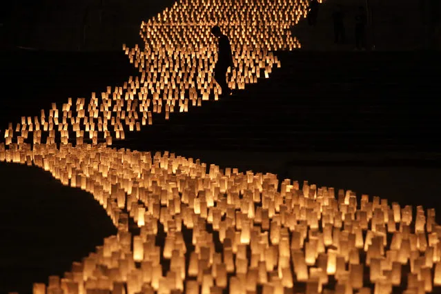 Thousands of candles are arranged in the shape of the Milky Way to celebrate Tanabata, a Japanese star festival, at Zojoji Temple, Friday, July 5, 2019, in Tokyo. (Photo by Jae C. Hong/AP Photo)
