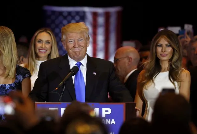 Republican U.S. presidential candidate Donald Trump smiles as he speaks with his wife Melania (R) at his side at the start of a campaign victory party after rival candidate Senator Ted Cruz dropped after the race for the Republican presidential nomination, at Trump Tower in Manhattan, New York, U.S., May 3, 2016. (Photo by Lucas Jackson/Reuters)