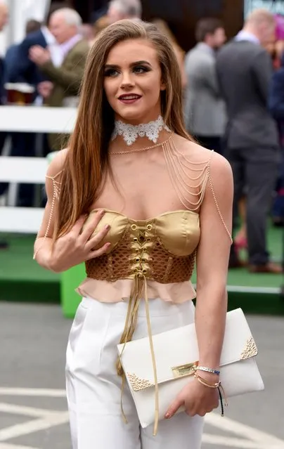 Racegoer in gleaming corset shows she has firm grip on fashion during the Grand National Festival at Aintree Racecourse on April 7, 2017 in Liverpool, England. (Photo by Fortitude Press)