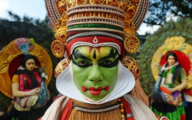 Performers take part in a “Kummati Kali”, mask dance, part of the annual Onam festival celebrations in Thrissur district in the Indian state of Kerala on September 13, 2019. (Photo by Arun Sankar/AFP Photo)
