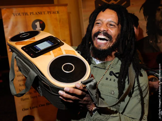 Rohan Marley, son of late Reggae musician Bob Marley, displays the USD 249 Bag of Rhythm audio player with docking station for iPhones and iPods from House of Marley