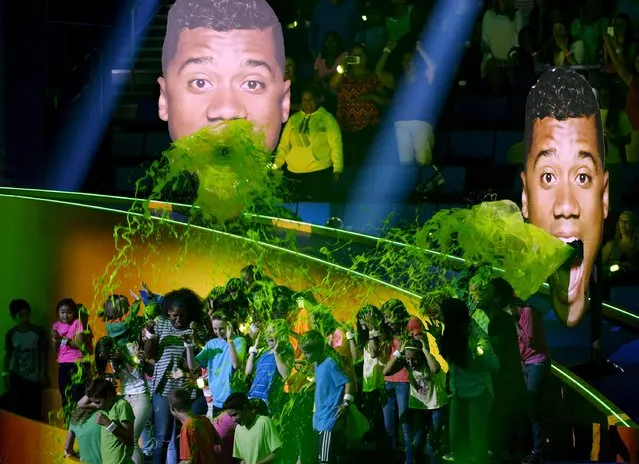 Green slime pours out of from cut out pictures of host, Seattle Seahawks quarterback Russell Wilson, during the Nickelodeon Kids' Choice Sports Awards 2015 at UCLA's Pauley Pavilion in Los Angeles, California July 16, 2015. (Photo by Kevork Djansezian/Reuters)