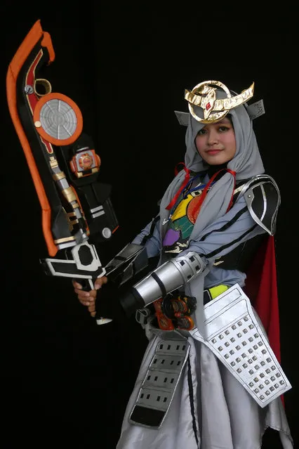 Ange, a young Indonesian Muslim cosplayer dressed as the Kamen rider Gaim, takes part in the “Hijab Cosplay” event in Subang Jaya, outside of Kuala Lumpur, on April 29, 2017. (Photo by Manan Vatsyayana/AFP Photo)