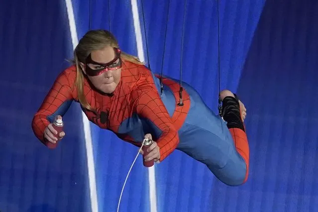 Amy Schumer appears on stage dressed as Spider-Man during a skit at the Oscars on Sunday, March 27, 2022, at the Dolby Theatre in Los Angeles. (Photo by Chris Pizzello/AP Photo)