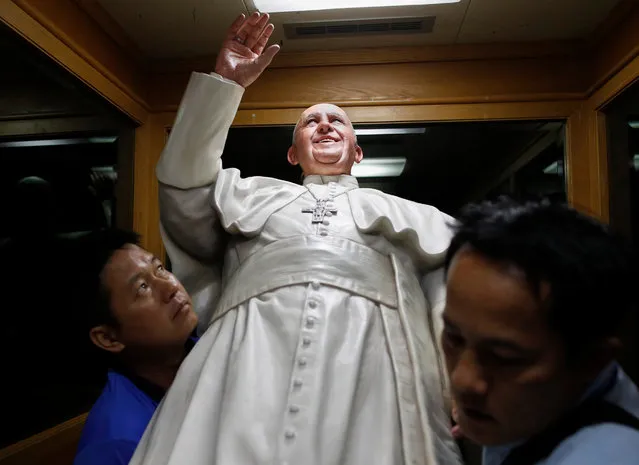 Thai workers carry a statue of Pope Francis at Saint Louis Hospital in Bangkok, Thailand, 11 November 2019. Pope Francis will visit Thailand from 20 to 23 November 2019 on the occasion of the 350th anniversary of the founding of Mission de Siam. Pope Francis is the first pontiff to visit Thailand in nearly four decades after John Paul II in 1984. (Photo by Rungroj Yongrit/EPA/EFE)