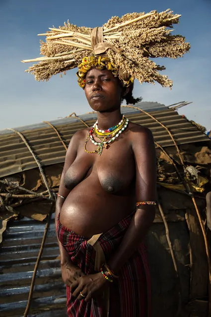 “Dassanech Woman”. Pregnant tribal women from the Dassanech Tribe in traditional clothing in Omo Valley, Ethiopia. Photo location: Omo Valley, Ethiopia. (Photo and caption by Amy Nicole Harris/National Geographic Photo Contest)