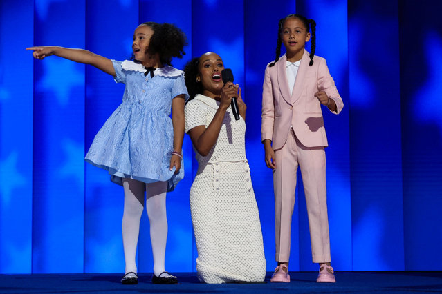 Kerry Washington, center, with grand-nieces of Vice President Kamala Harris Amara Ajagu, right, and Leela Ajagu, speak during the Democratic National Convention Thursday, August 22, 2024, in Chicago. (Photo by Kevin Wurm/Reuters)