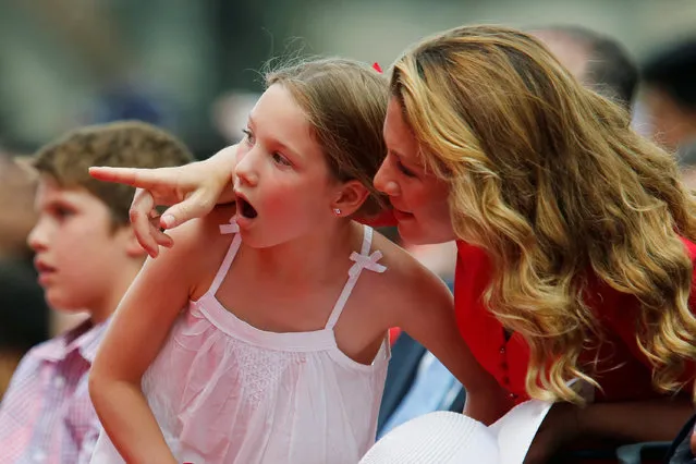 Sophie Gregoire Trudeau (R), wife of Canada's Prime Minister Justin Trudeau, watches performers with their daughter Ella-Grace during Canada Day celebrations on Parliament Hill in Ottawa, Ontario, Canada, July 1, 2016. (Photo by Chris Wattie/Reuters)