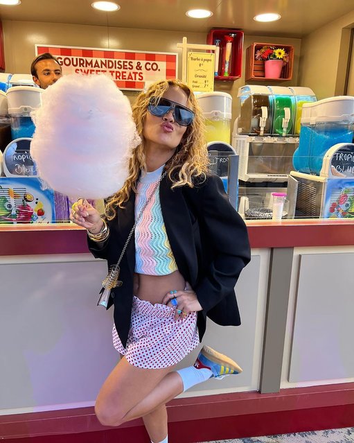 British singer-songwriter Rita Ora enjoys some cotton candy while at Disneyland Paris in the last decade of July 2022. (Photo by ritaora/Instagram)