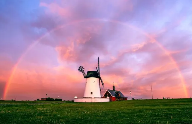 A rainbow over the windmill in Lytham, Lancashire on May 17, 2022 at sunset after rain hit the region last night after the hottest day of the year. (Photo by Gregg Wolstenholme/Bav Media)