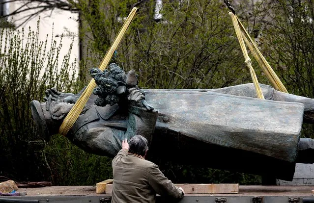 The statue of Soviet World War II commander Ivan Stepanovic Konev is loaded on a truck after removal from its platform in Prague, Czech Republic, April 3, 2020. The municipal district of Prague 6 has ordered to remove the statue of Ivan Konev, a controversial Red Army general during WWII. The statue will be replaced by a memorial dedicated to the liberation of Prague in 1945. (Photo by David W. Cerny/Reuters)