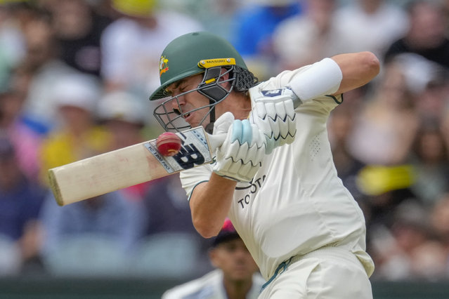 Australia's captain Pat Cummins plays a shot during play on the second day of the fourth cricket test between Australia and India at the Melbourne Cricket Ground, Melbourne, Australia, Friday, December 27, 2024. (Photo by Asanka Brendon Ratnayake/AP Photo)