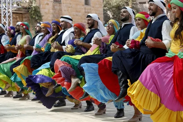 Lebanese traditional dancers perform the Dabkeh during a traditional dance festival held in Maaser al Shouf  village in Mount Lebanon September 13, 2015. (Photo by Jamal Saidi/Reuters)