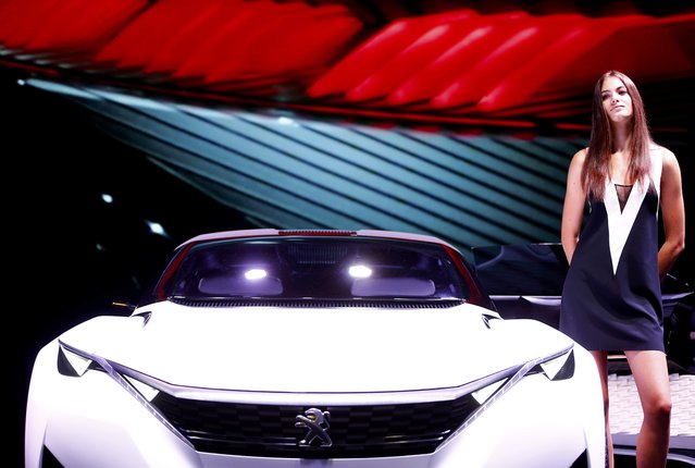 A model poses next to the Peugeot Fractal Concept during the media day at the Frankfurt Motor Show (IAA) in Frankfurt, Germany September 15, 2015. (Photo by Kai Pfaffenbach/Reuters)