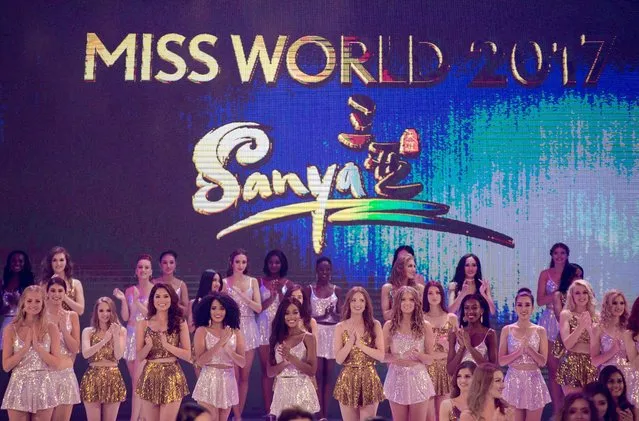 Contestants pose during the 67th Miss World contest final in Sanya, on the tropical Chinese island of Hainan on November 18, 2017. (Photo by Nicolas Asfouri/AFP Photo)