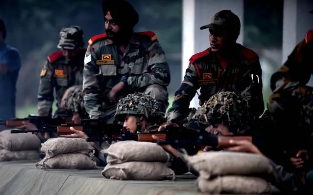 Indian cadets fire rifles as they take part in weapons training at an Officers Training Academy in Chennai on August 26, 2016, where India's President Pranab Mukherjee is scheduled to review a passing out parade of cadets on September 10. (Photo by Arun Sankar/AFP Photo)