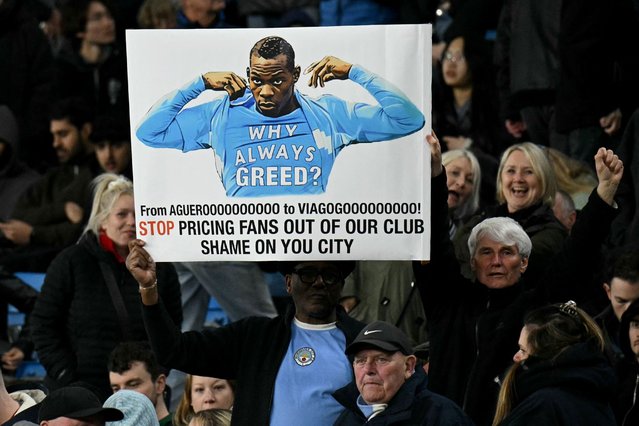Fans hold a banner in protest of ticket prices during the English Premier League football match between Manchester City and Leicester City at the Etihad Stadium in Manchester, north west England, on April 2, 2025. (Photo by Oli Scarff/AFP Photo)