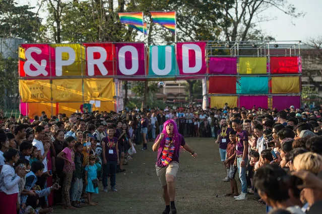 This photo taken on January 28, 2018 shows a participant (C) running in a high-heel game during the “&Proud” LGBT festival in Yangon. (Photo by Ye Aung Thu/AFP Photo)