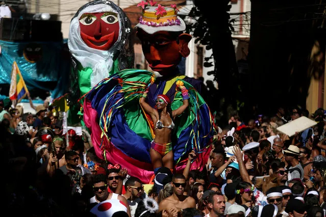 Revellers take part in the annual block party known as “Carmelitas”, during carnival festivities in Rio de Janeiro, Brazil on February 9, 2018. (Photo by Pilar Olivares/Reuters)