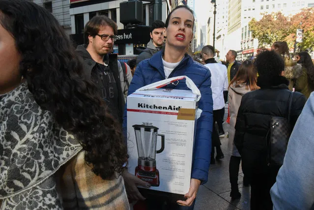 People shop in Herald Square on “Black Friday” on November 24, 2017 in New York City. (Photo by Stephanie Keith/Getty Images)