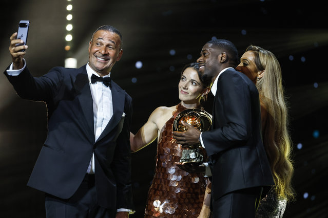 Former Dutch footballer Ruud Gullit (L) takes a picture with Paris Saint-Germain's player Ousmane Dembele (2-R) and Barcelona's Aitana Bonmati (2-L) during the Ballon d'Or 2025 ceremony at the Theatre du Chatelet in Paris, France, 22 September 2025. Aitana Bonmati won the Women's Ballon d'Or 2025 and Ousmane Dembele won the Ballon d'Or 2025. (Photo by Mohammed Badra/EPA)