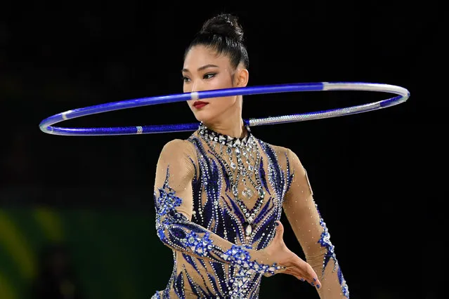 Australia’s Enid Sung competes in the hoop event of the rhythmic gymnastics team final and individual qualification during the 2018 Gold Coast Commonwealth Games at the Coomera Indoor Sports Centre on the Gold Coast on April 11, 2018. (Photo by William West/AFP Photo)