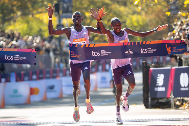 Benson Kipruto and Alexander Mutiso cross the finish line to win first and second place in the men's elite division of the New York City Marathon, Sunday, November 2, 2025, in New York. (Photo by Angelina Katsanis/AP Photo)