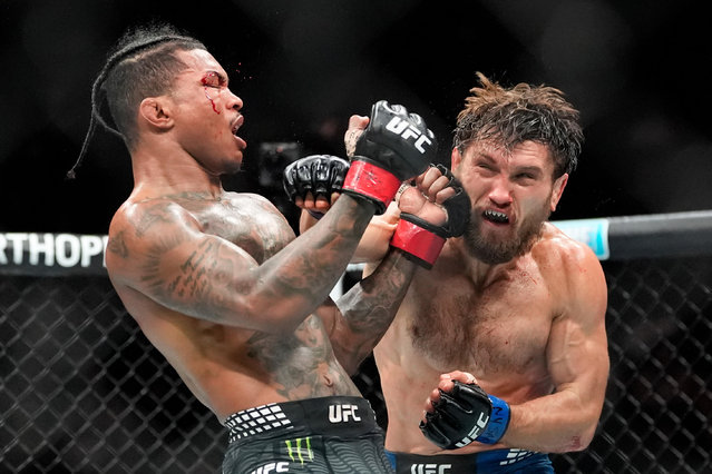 Ethyn Ewing, right, punches Malcolm Wellmaker, left, during the third round of a featherweight bout at the UFC 322 mixed martial arts event, Saturday, November 15, 2025, in New York. (Photo by Yuki Iwamura/AP Photo)