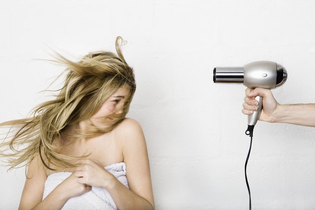 Woman having her hair dried. (Photo by Bernd Vogel/Getty Images)