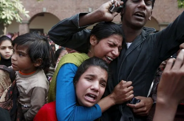 Women from the Christian community mourn for a relative, who was one of the victims killed by a suicide attack on a church, during his funeral in Lahore, Pakistan March 17, 2015. (Photo by Mohsin Raza/Reuters)