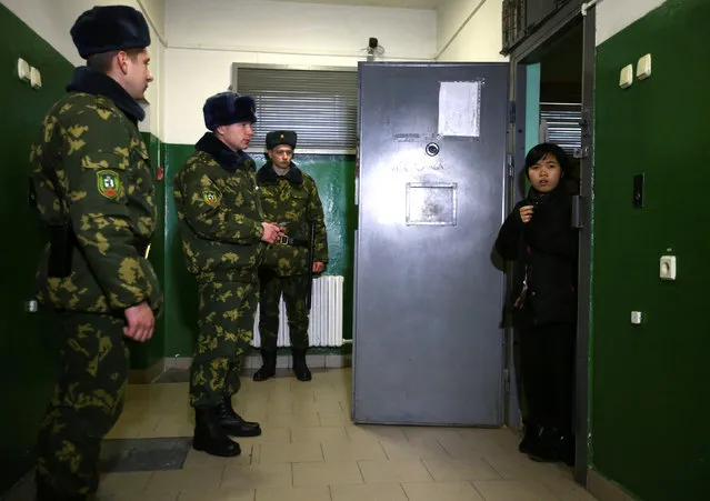 A Vietnamese detained while attempting to cross the border illegally from Belarus to Lithuania, according to border officials, is seen in a cell in a temporary detention facility in Smorgon, Belarus, November 22, 2016. (Photo by Vasily Fedosenko/Reuters)