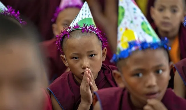 Young monks offer prayers during celebrations to mark the birthday of their spiritual leader the Dalai Lama in Kathmandu, Nepal, Thursday, July 6, 2023. (Photo by Niranjan Shrestha/AP Photo)