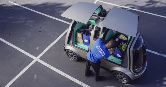 This undated image provided by The Kroger Co. shows an autonomous vehicle called the R1. Kroger will begin testing grocery deliveries using driverless cars outside of Phoenix. The grocery chain said the project will begin Thursday, August 16, 2018, in Scottsdale, at a Fry's supermarket, which is owned by Kroger. The Toyota Prius will be used for the deliveries, manned by a human to monitor its performance. During phase two in the fall deliveries will be made by the R1 with no human aboard. (Photo by The Kroger Co. via AP Photo)