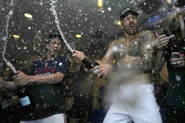Minnesota Twins' Kenta Maeda, left, and Carlos Correa celebrate after the team's 8-6 win over the Los Angeles Angels in a baseball game Friday, September 22, 2023, in Minneapolis. The Twins clinched the AL Central title. (Photo by Abbie Parr/AP Photo)