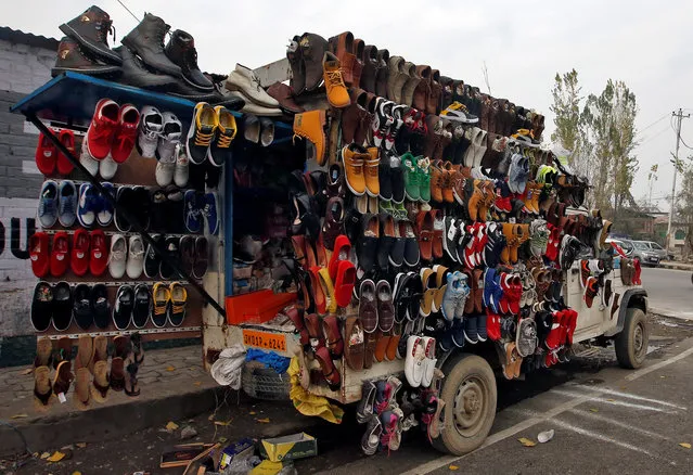 Shoes are displayed for sale, on a parked vehicle, alongside a road in Srinagar November 18, 2018. (Photo by Danish Ismail/Reuters)